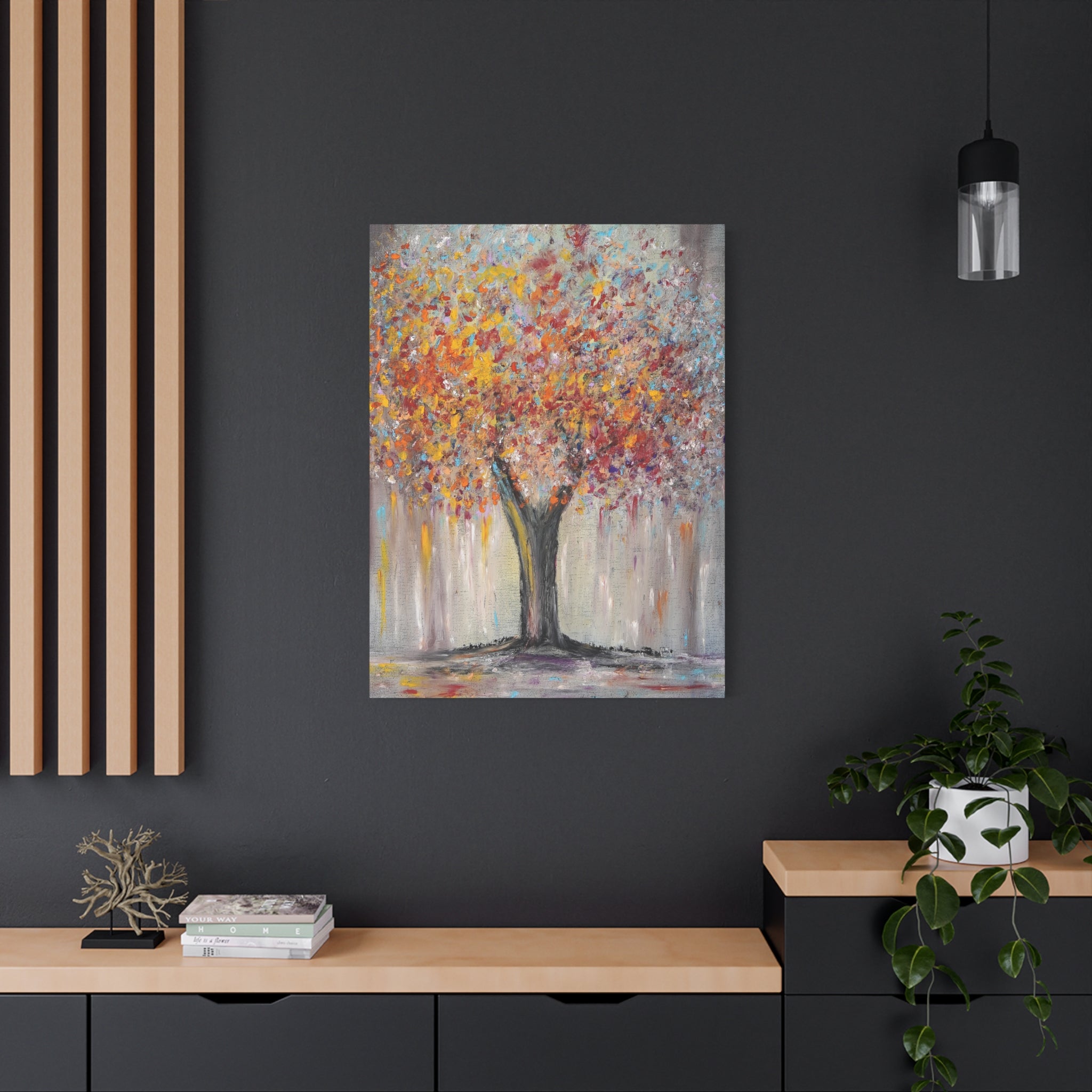 Abstract printed Canvas Matte of a tree with autumn colors on a dark wall above a wooden console table.