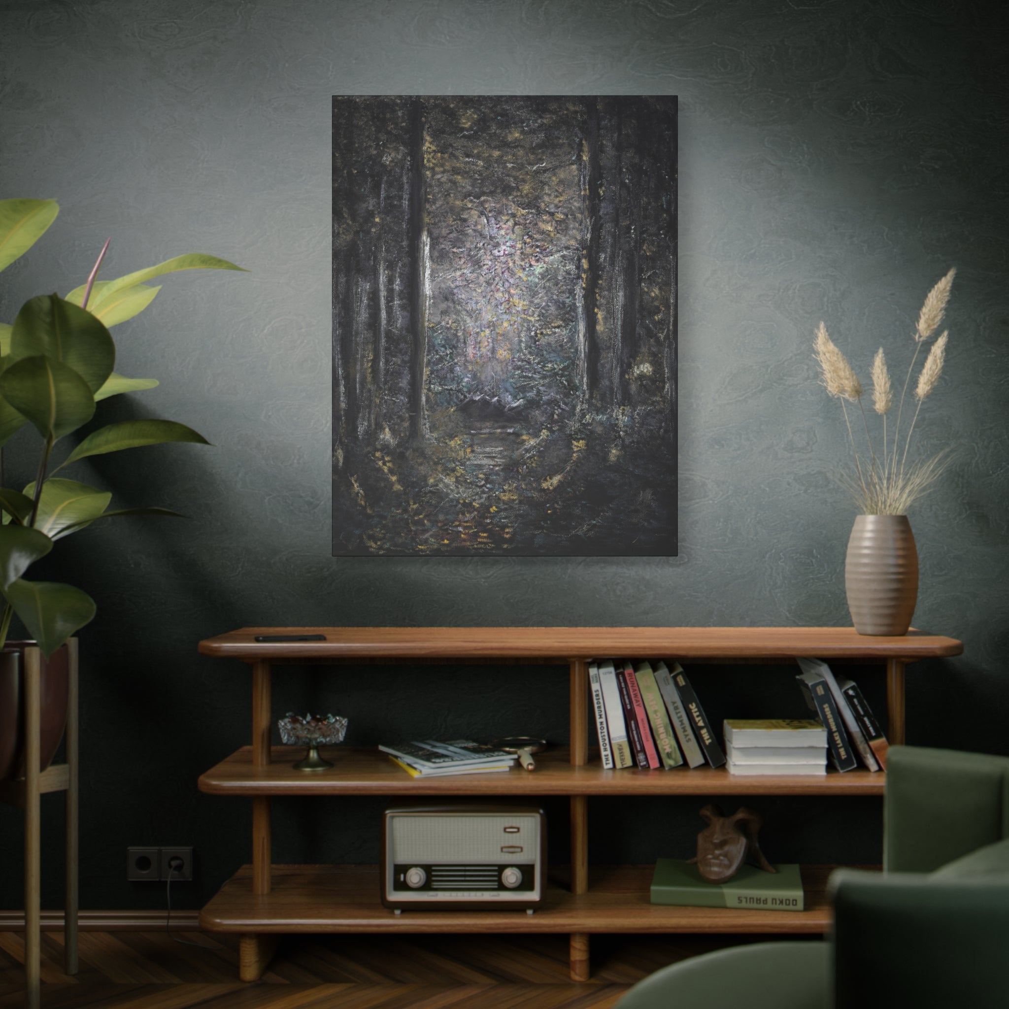 Room interior with a wooden shelf, books, a plant, and a canvas print of a mysterious woodland on a dark wall.