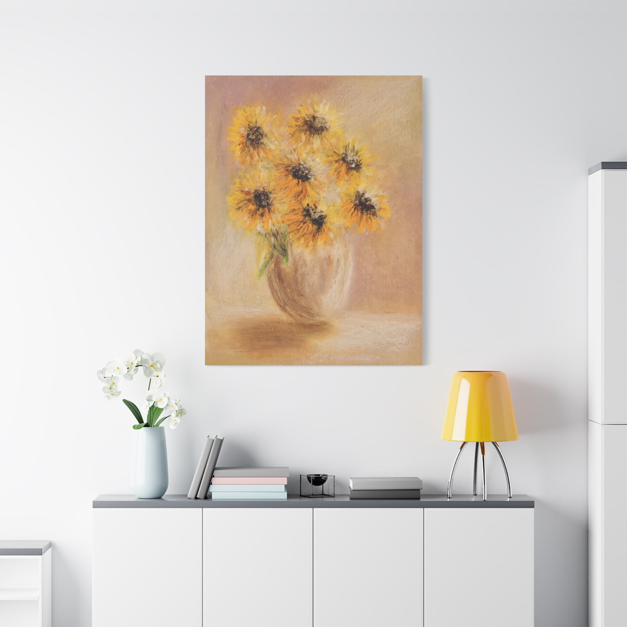 Sunflower Vase Canvas — Matte Stretched Wall Art of sunflowers on a wall above a white cabinet with decorative items.