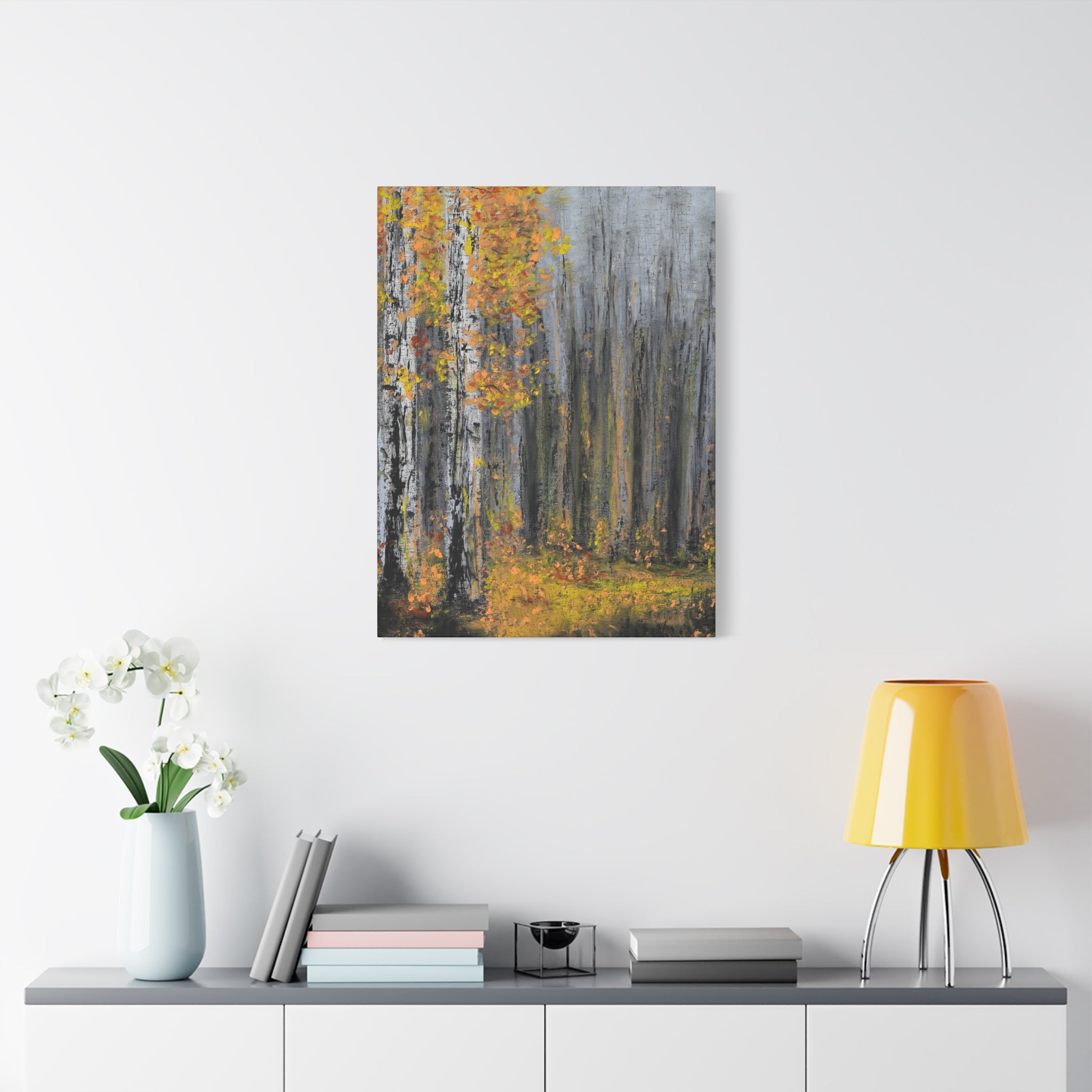 Canvas Art Matte print of a forest scene on a wall above a shelf with decor items.